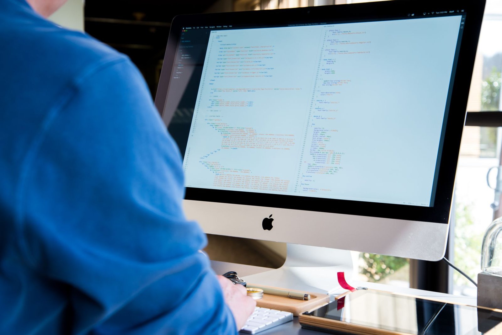 Software developer focused on writing unit tests using a computer, highlighting CodiumAI's capabilities.
