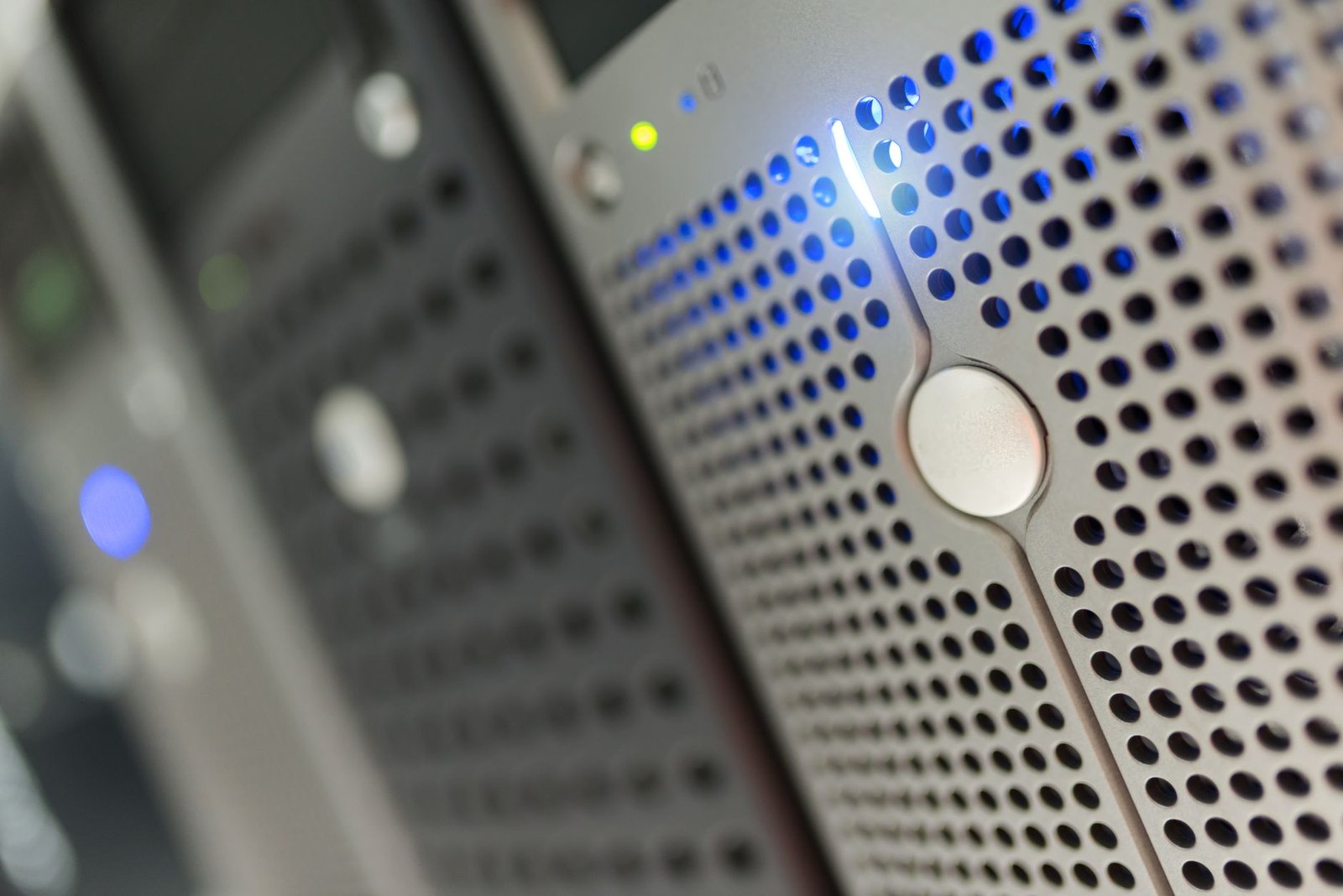 Close-up view of blinking lights on a server rack in a data center.