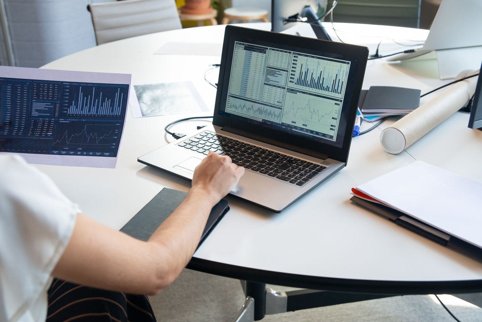 A modern workstation featuring a laptop with AI content analytics dashboard.