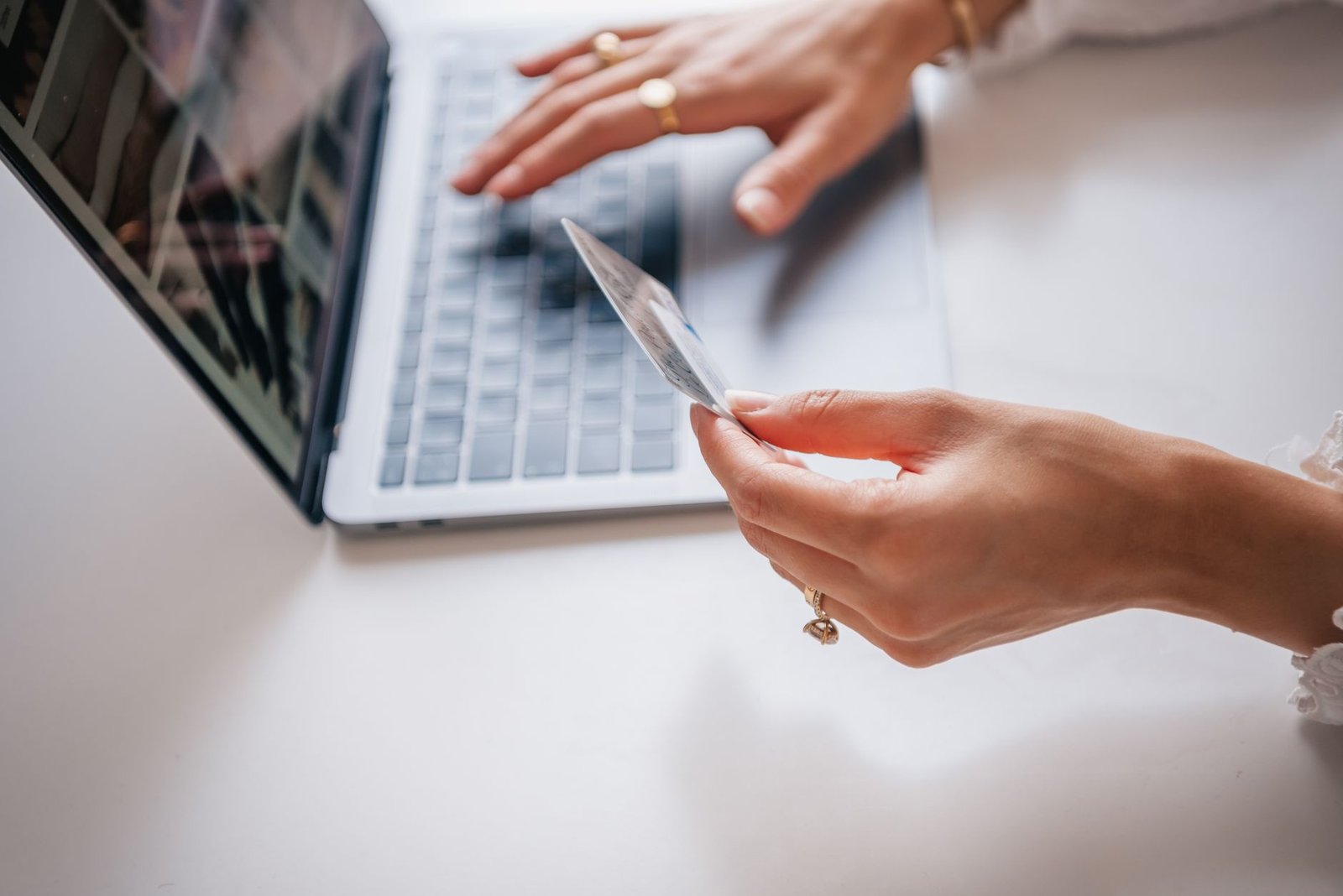 A person typing on a laptop with a digital padlock icon symbolizing security.