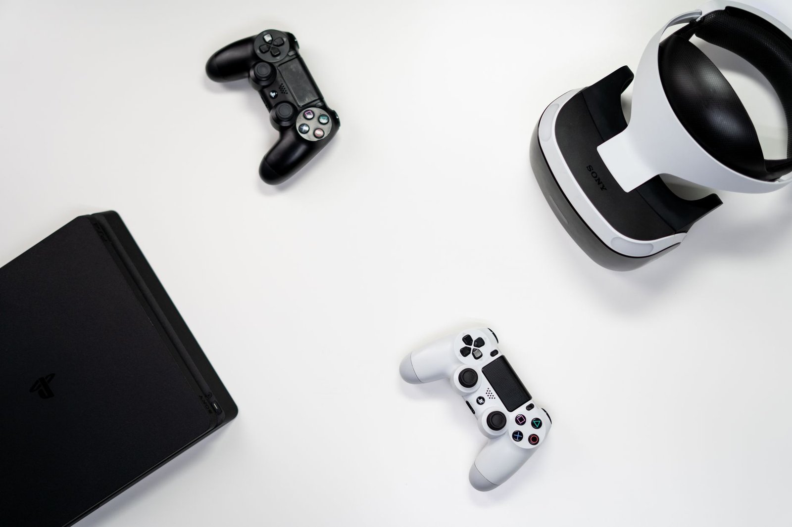 PlayStation VR3 headset and controllers displayed alongside a PS5 console.