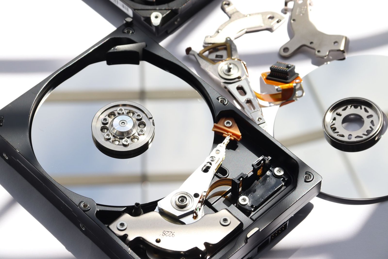 A collection of various computer storage drives including SSDs.